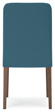 Ashley Furniture Lyncott dining room set with a table and chairs, shown from the back view in a modern dining space.