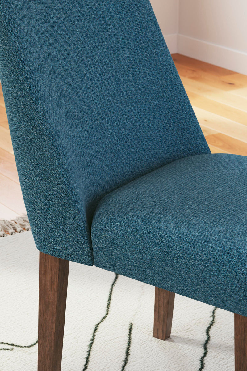 Close-up of Ashley Furniture Lyncott dining room set with a wooden table and upholstered chairs, detailed design and craftsmanship.