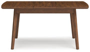 Ashley Furniture Lyncott Dining Extension Table with wooden surface and sturdy legs, shown from the back view.