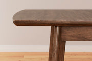 Ashley Furniture Lyncott Dining Extension Table with detailed wood finish and elegant design, perfect for family meals.