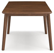 Ashley Furniture Lyncott dining extension table with a wooden surface and sturdy legs, set for a modern dining room setup.
