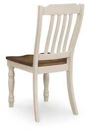 Ashley Furniture Wirloni dining chair with dark wood finish and upholstered seat, shown from the back.