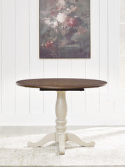 Ashley Furniture Wirloni dining drop leaf table with wood finish, showing the table with extended leaves and sturdy legs.