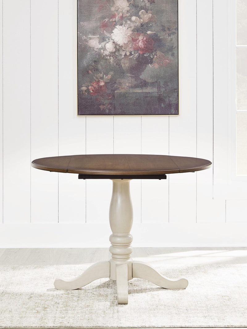 Ashley Furniture Wirloni dining drop leaf table with wood finish, showing the table with extended leaves and sturdy legs.