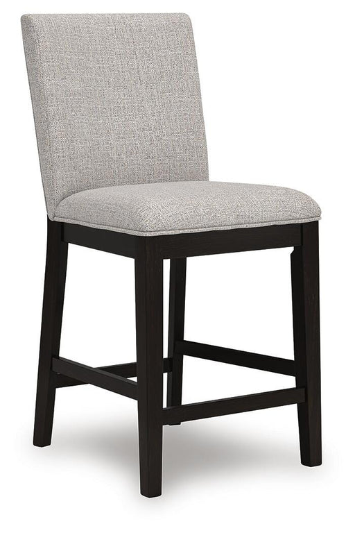 Ashley Furniture Neymorton counter height barstool with wooden legs and upholstered seat, angled view from the side.