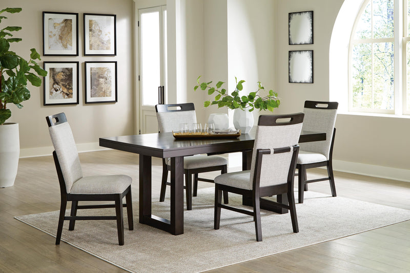 Ashley Furniture Neymorton dining room set with a wooden table and matching chairs, featuring a leaf design on the table surface.