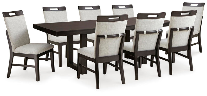Ashley Furniture Neymorton dining room set with a rectangular table and six upholstered chairs in a modern living space.