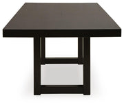 Ashley Furniture Neymorton dining room set with a wooden table and matching chairs, shown in a modern dining space.