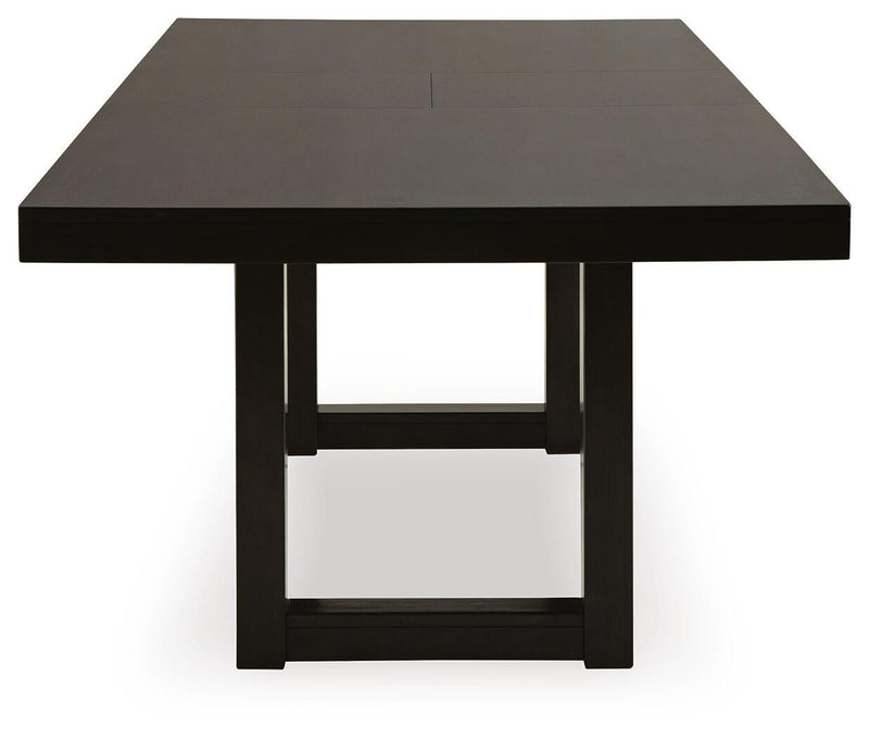Ashley Furniture Neymorton dining room set with a wooden table and matching chairs, shown in a modern dining space.
