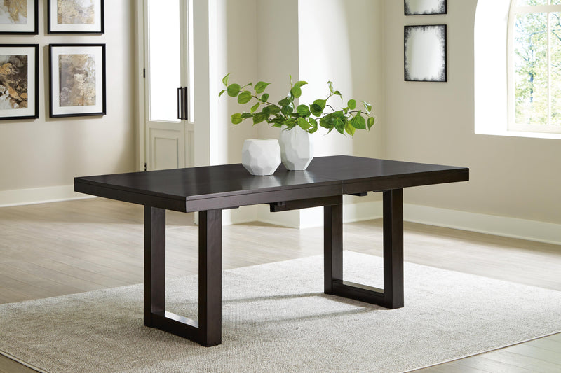 Ashley Furniture Neymorton dining room set with a wooden table and six matching chairs, featuring a leaf-shaped table design.