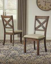 Ashley Furniture Moriville counter height dining set with a wooden table and matching chairs in a modern dining room.