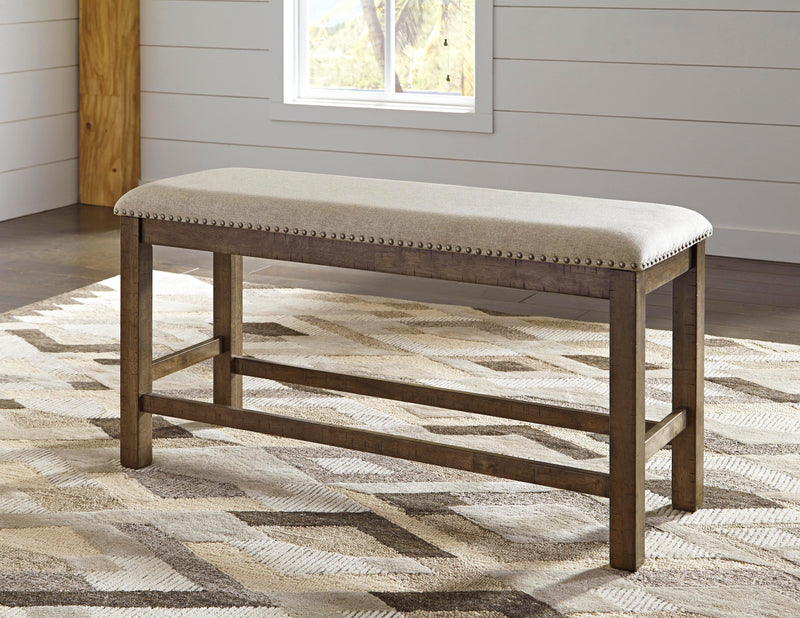 Ashley Furniture Moriville counter height dining set with a wooden table and matching chairs in a modern dining room.