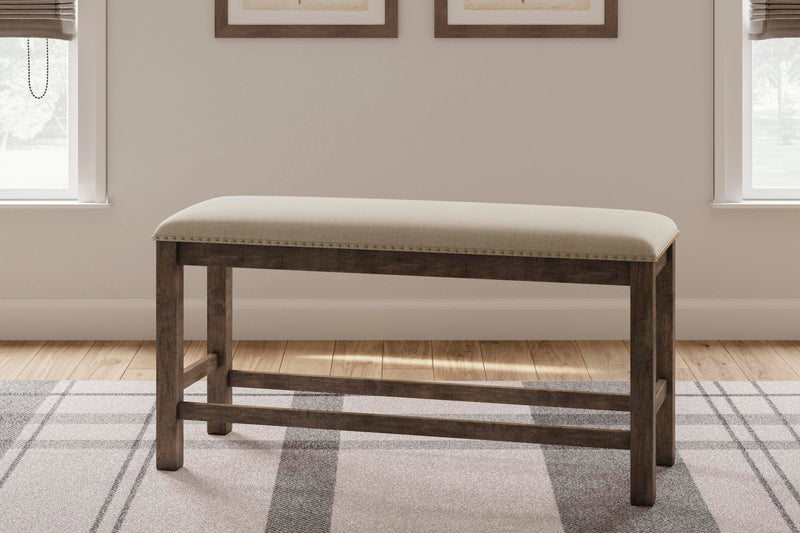 Ashley Furniture Moriville counter height dining set with a wooden table and matching chairs in an elegant dining room setting.