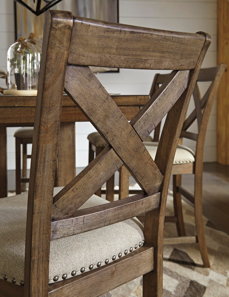 Ashley Furniture Moriville counter height dining set with table and chairs, featuring a warm wood finish and modern design.