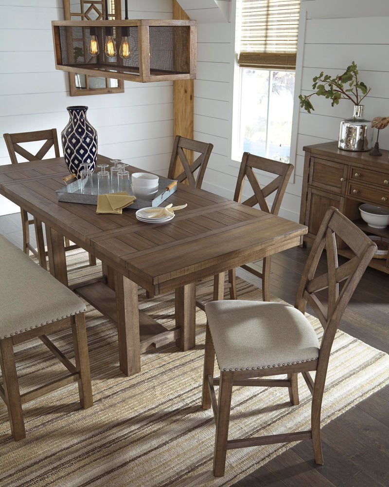 Ashley Furniture Moriville counter height dining set with four chairs and a rectangular table in a modern dining room setting.