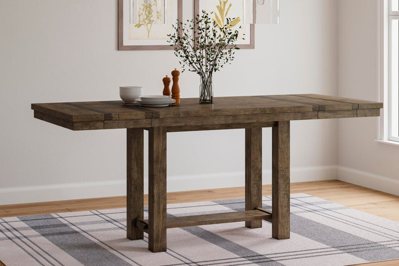 Ashley Furniture Moriville counter height dining set with a wooden table and six matching chairs, in an elegant dining room setting.