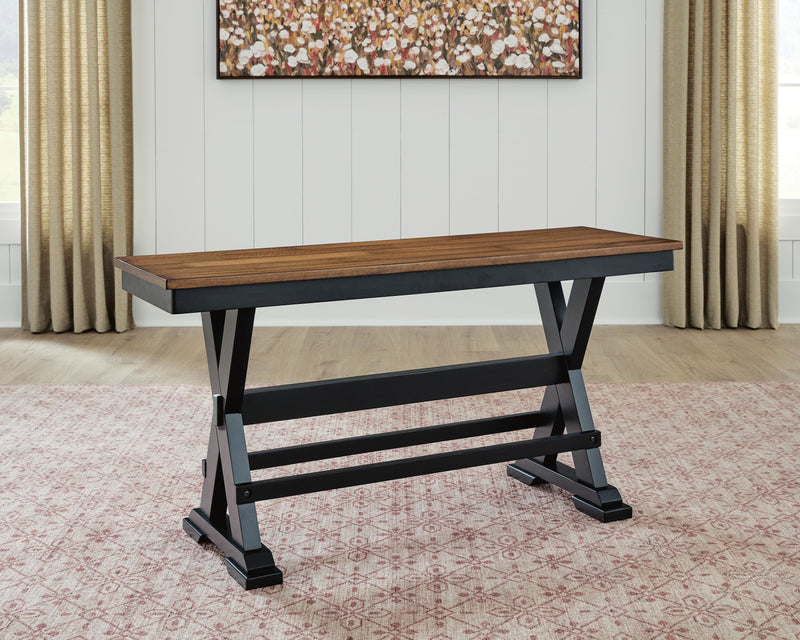 Wildenauer 48-inch counter height bench by Ashley Furniture with wooden legs and cushioned seat, ideal for kitchen or dining area.
