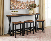 Ashley Furniture Wildenauer counter height dining table with three matching barstools, featuring a sleek wood finish and modern design.