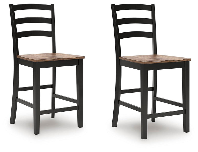 Ashley Furniture Wildenauer counter height barstool with a wooden frame and cushioned seat, shown from an angled side view.