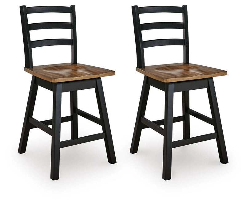 Ashley Furniture Wildenauer counter height swivel barstool with wooden legs and cushioned seat, shown from an angled side view.
