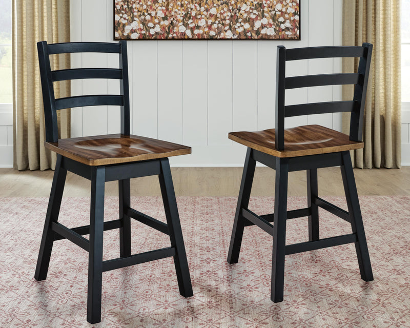 Ashley Furniture Wildenauer counter height swivel barstool with wooden seat and metal frame, shown from a side angle.