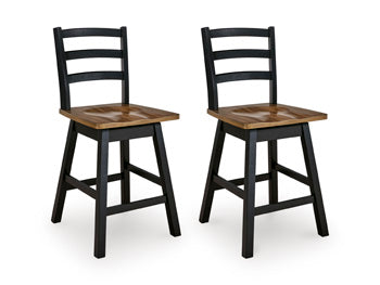 Ashley Furniture Wildenauer counter height swivel barstool with wooden legs and a cushioned seat, shown from an angled view.