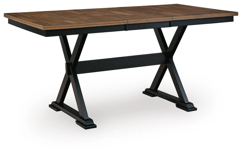 Ashley Furniture Wildenauer counter height butterfly extension table shown from an angle, featuring wood finish and extendable leaves.
