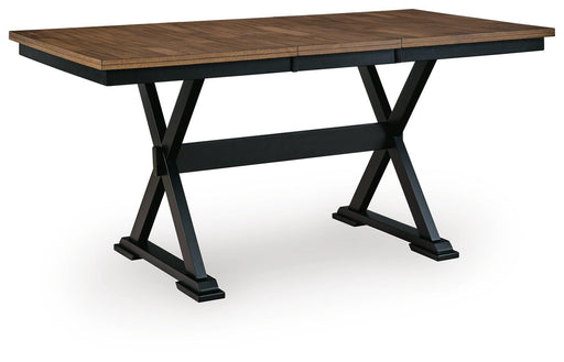 Ashley Furniture Wildenauer counter height butterfly extension table shown from an angle, featuring wood finish and extendable leaves.