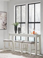 Ashley Furniture Robbinsdale counter height dining table with three matching barstools, featuring a modern wooden design.