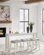 Ashley Furniture Robbinsdale counter height dining table with three matching barstools, featuring a stylish wooden finish and modern design.