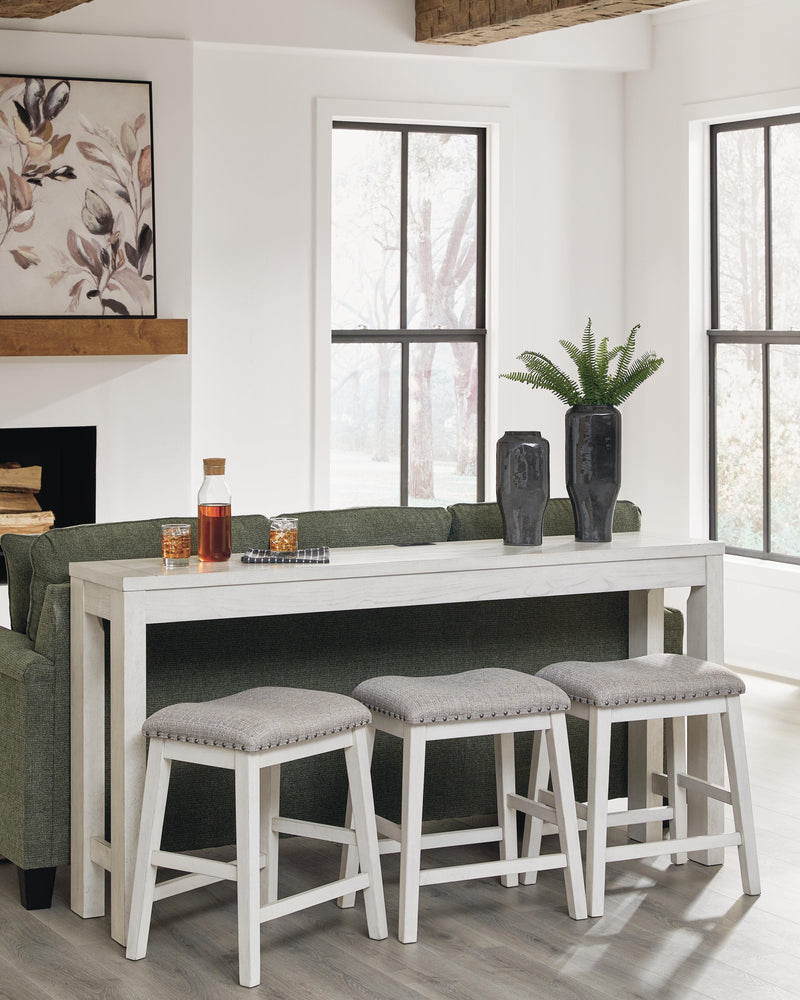 Ashley Furniture Robbinsdale counter height dining table with three matching barstools, featuring a sleek wooden design.