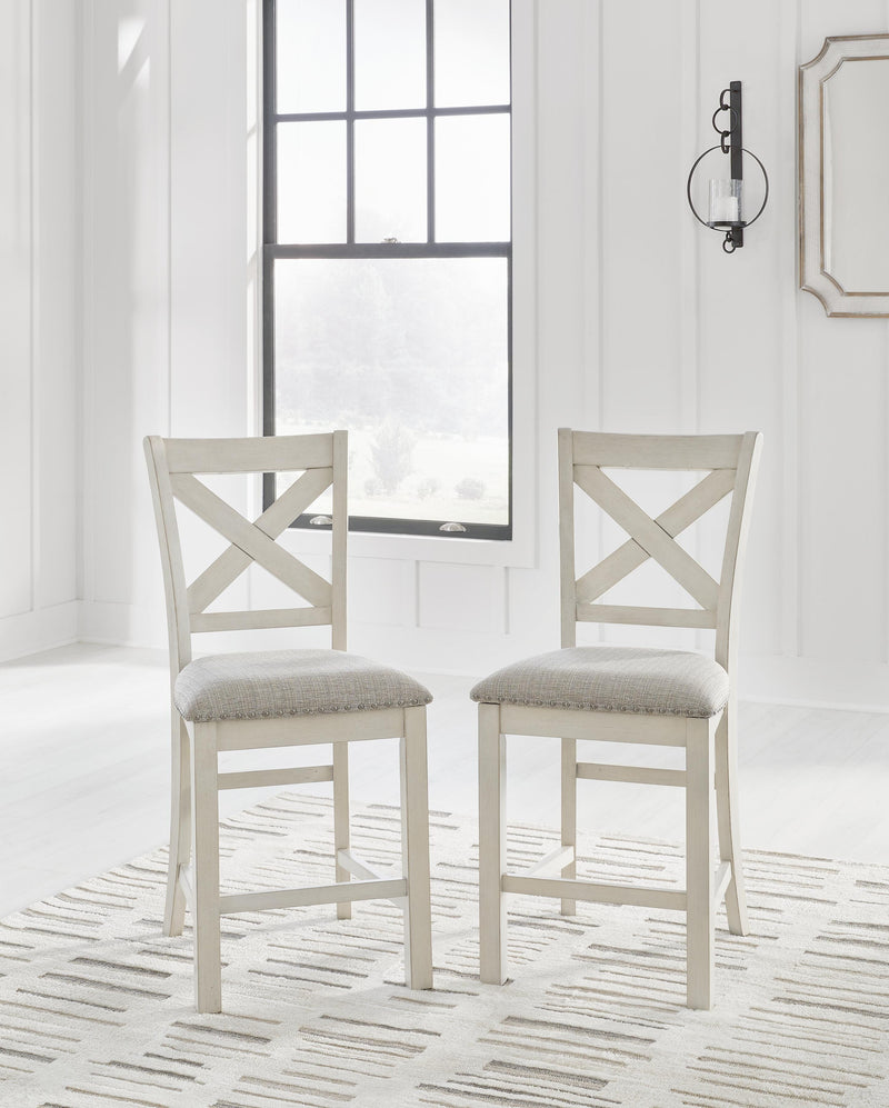Ashley Furniture Robbinsdale dining package featuring a casual seating set with table and chairs for stylish dining.