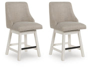 Set of two Robbinsdale counter height barstools by Ashley Furniture with wooden legs and cushioned seats, angled view.
