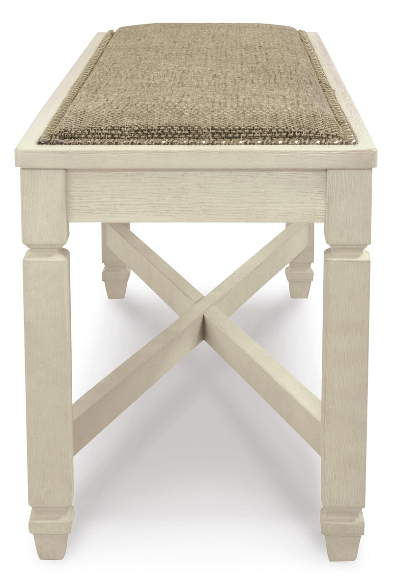 Ashley Furniture Bolanburg dining bench with wood finish and upholstered seat, shown from side view.