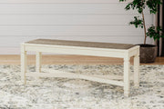 Ashley Furniture Bolanburg dining room set with a table and six chairs in a warm wood finish, ideal for a modern dining space.