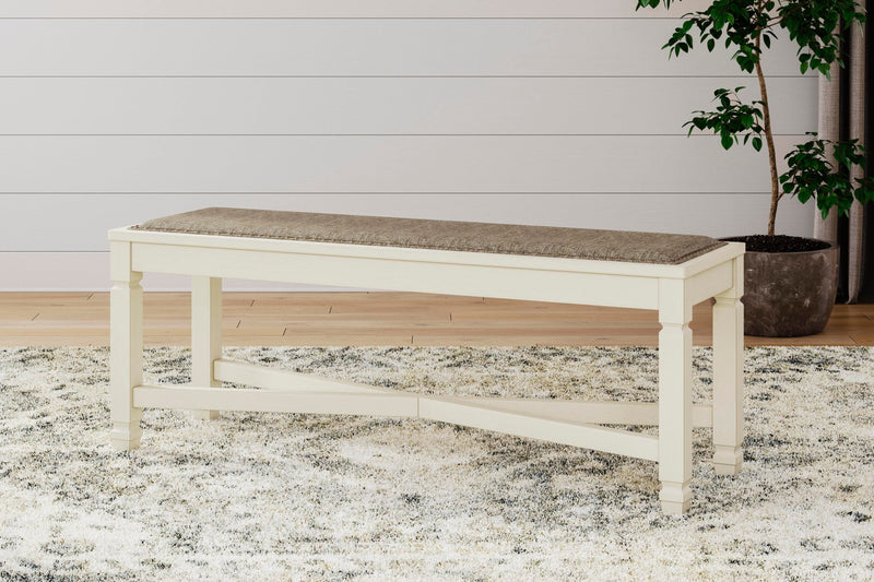 Ashley Furniture Bolanburg dining room set with a table and six chairs in a warm wood finish, ideal for a modern dining space.