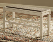 Ashley Furniture Bolanburg counter height dining bench with wooden seat and sturdy legs, designed for kitchen or dining room use.