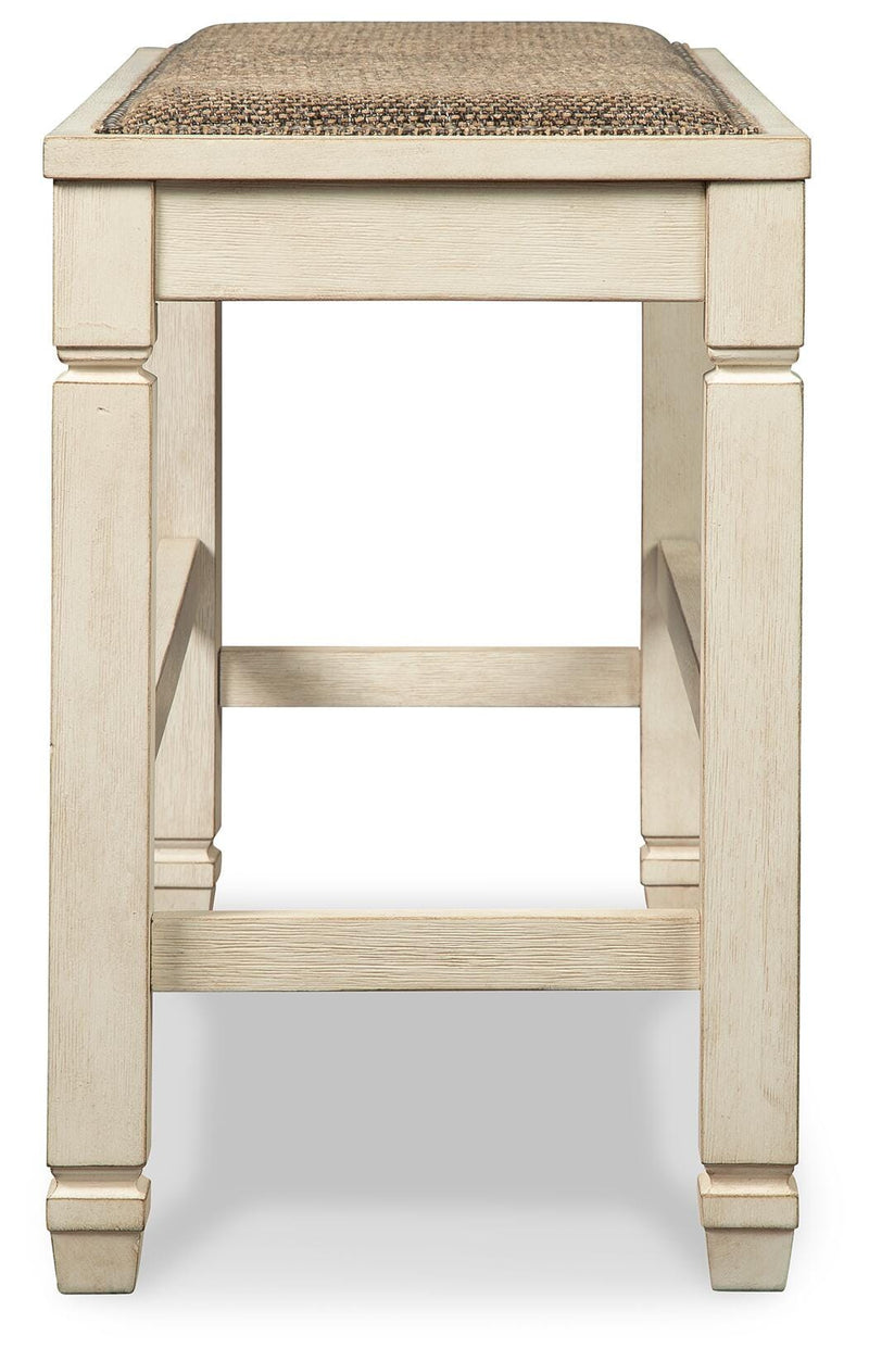 Ashley Furniture Bolanburg counter height dining bench with wooden legs and upholstered seat, shown from a side angle.
