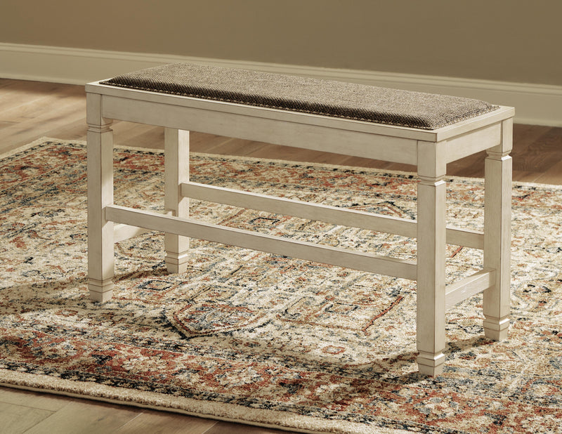 Ashley Furniture Bolanburg counter height dining bench with wooden frame and upholstered seat, shown in a modern dining room setting.