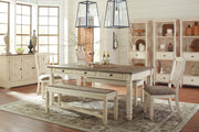 Ashley Furniture Bolanburg dining table with a wooden top and sturdy legs, ideal for family meals and gatherings.