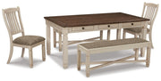 Ashley Furniture Bolanburg dining room set with a wooden table and matching chairs, shown in a well-lit dining space.