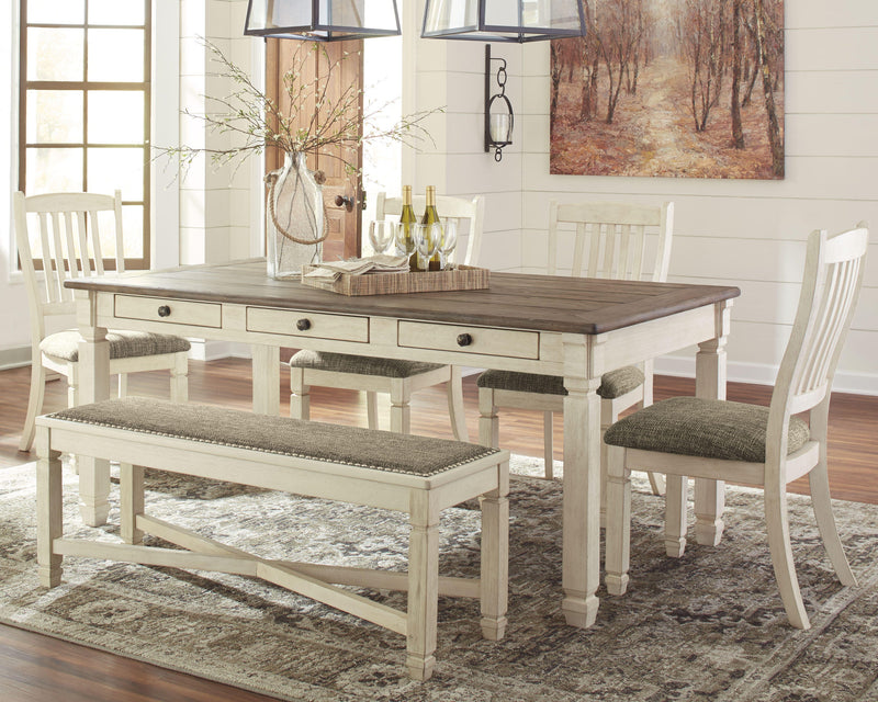 Ashley Furniture Bolanburg dining room set with a wooden table and six matching chairs in a modern dining space.