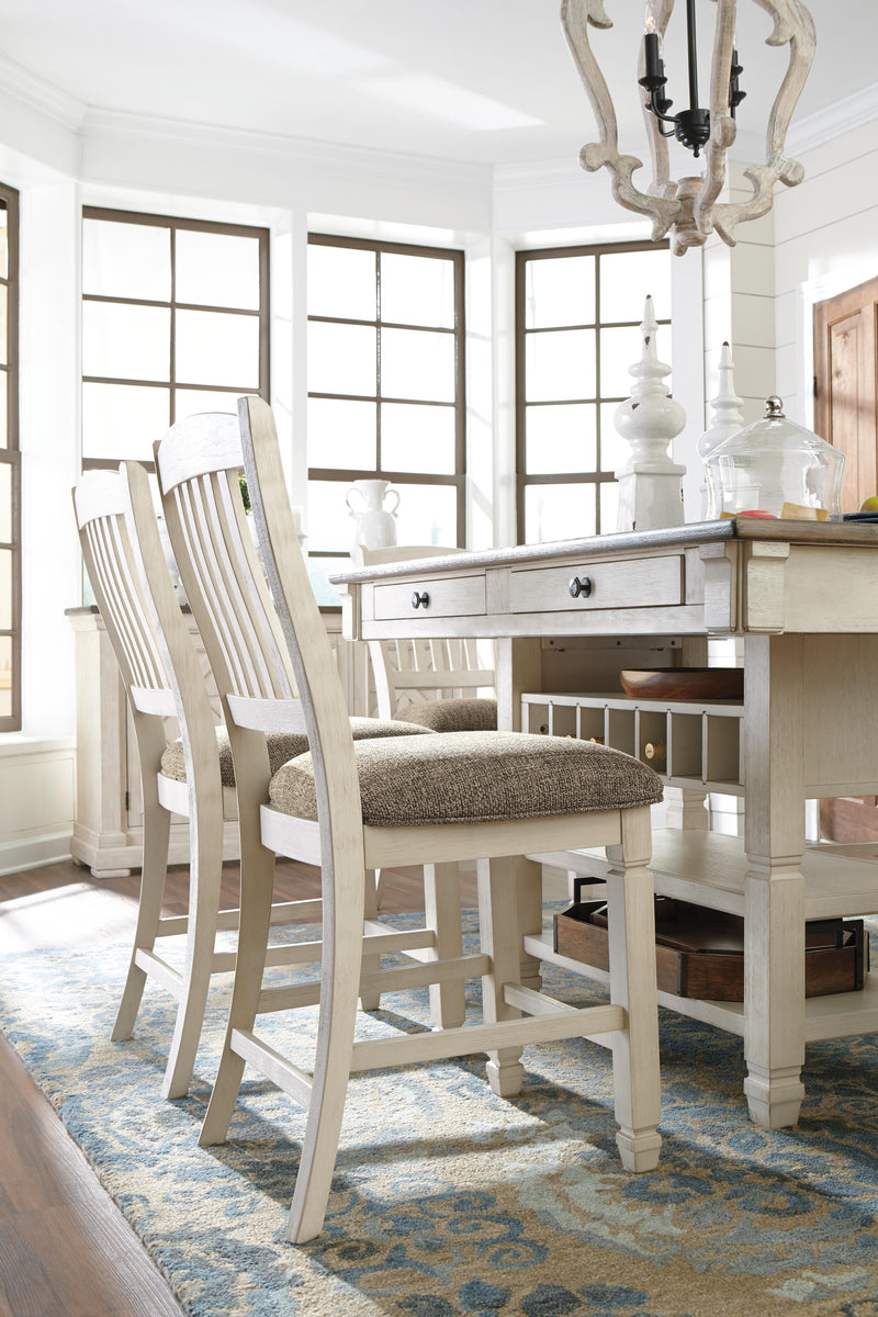 Ashley Furniture Bolanburg counter height dining table with a wood finish, shown with chairs in a modern dining room setting.