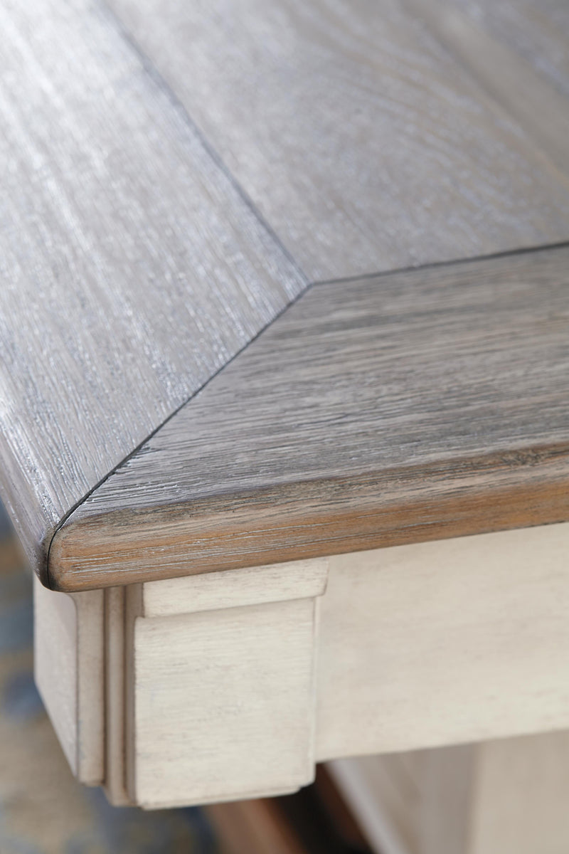 Close-up of the Ashley Furniture Bolanburg counter height dining table top, showcasing the wood grain and finish details.
