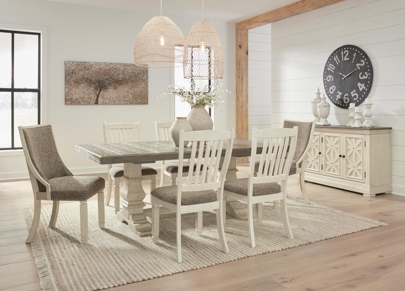 Ashley Furniture Bolanburg dining room set with a wooden table and six matching chairs, shown in a modern dining space.