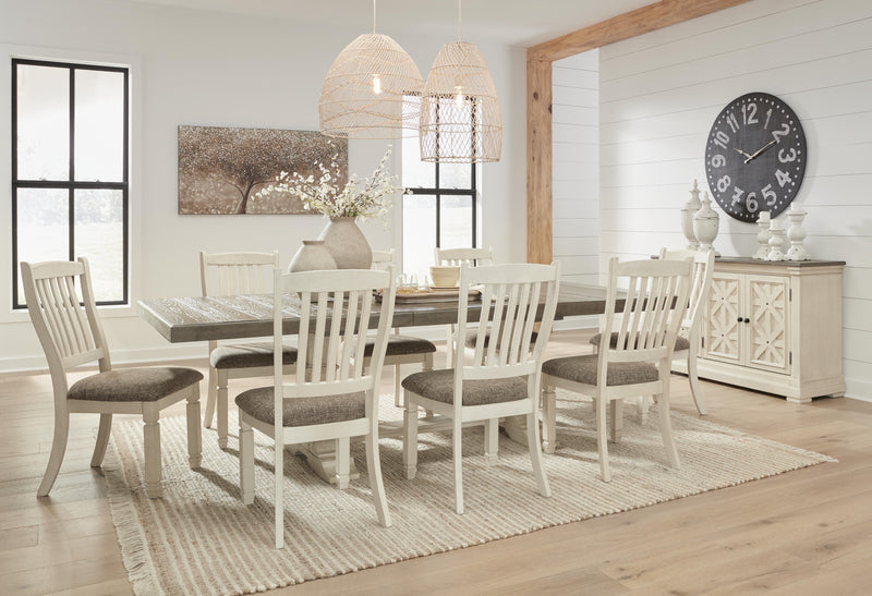 Ashley Furniture Bolanburg dining room set with a wooden table and six matching chairs in a modern dining space.