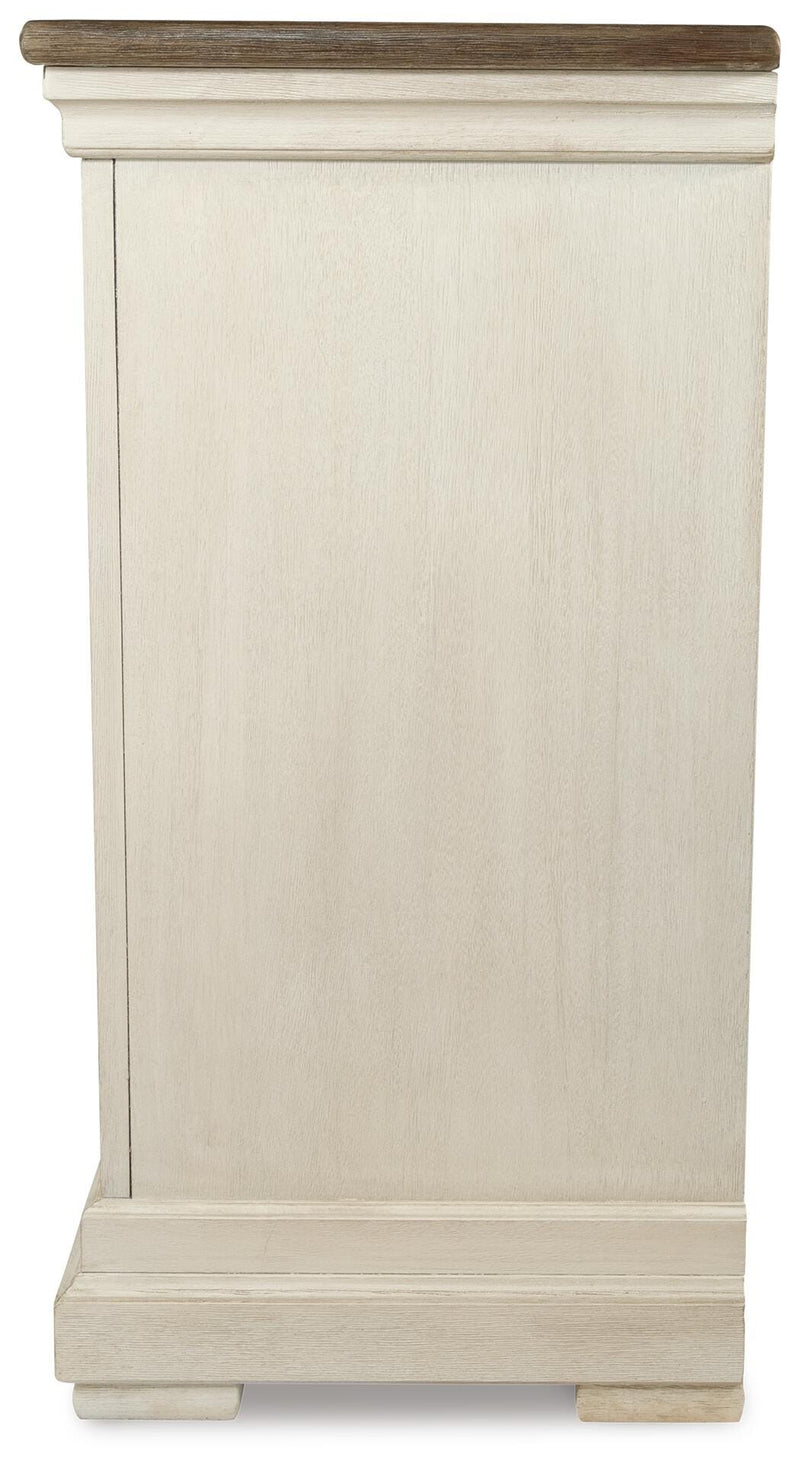 Ashley Furniture Bolanburg dining server with a sleek wood finish and multiple storage compartments, shown from a side angle.