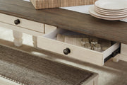 Close-up of the Ashley Furniture Bolanburg Dining Table showing its dark wood finish and detailed tabletop design.