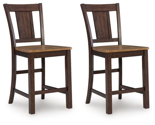 Ashley Furniture Rylandeen counter height barstool with wooden legs and cushioned seat, shown from an angled side view.