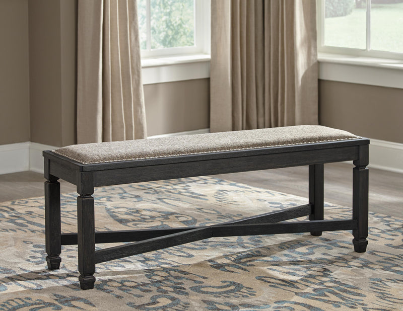 Ashley Furniture Tyler Creek dining room set with a wooden table and six matching chairs in a modern kitchen setting.